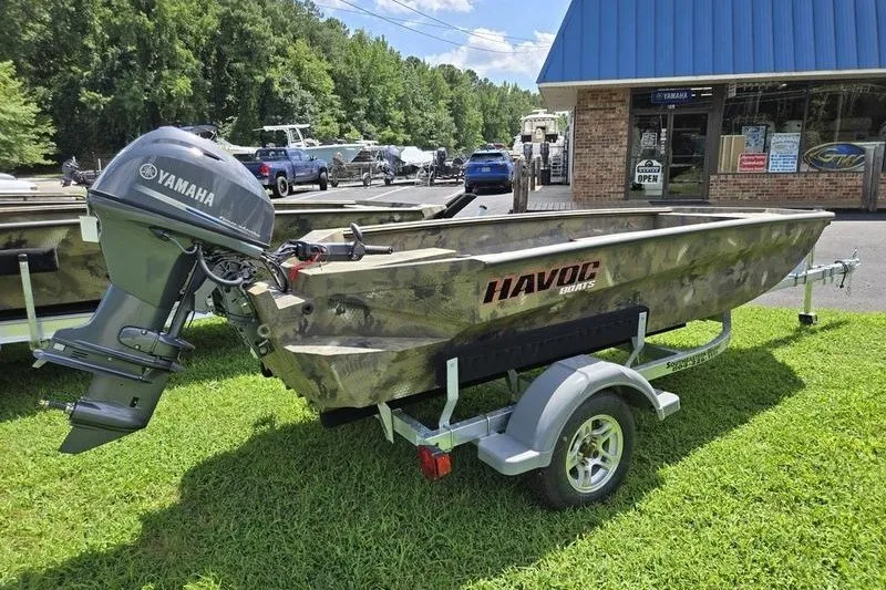 Slide: The Image of 2026 Havoc 1553 VJST boat with Yamaha motor on trailer, parked on grass. - 8