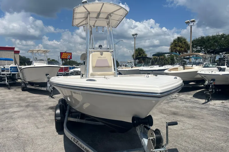Slide: The Image of Pathfinder 2005 TRS boat on trailer, displayed outdoors, 2023 model. - 9