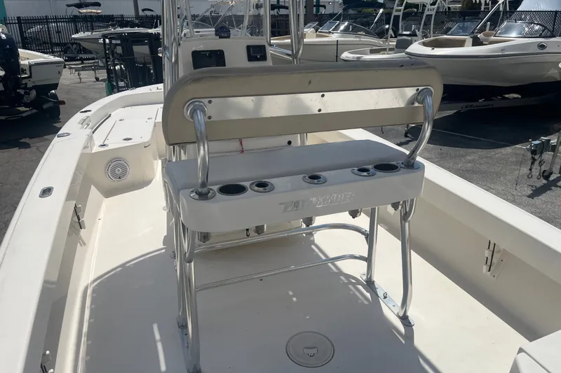 Slide: The Image of 2005 Pathfinder TRS boat interior with seating and rod holders, showcased in a marina setting. - 5