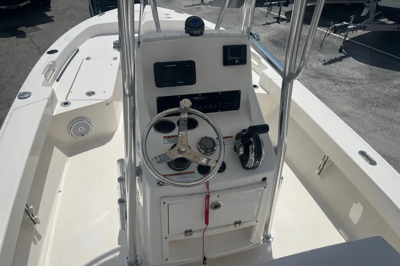 Slide: The Image of Center console of a 2023 Pathfinder 2005 TRS boat with steering wheel and controls. - 4