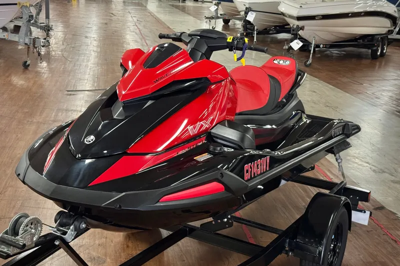 The Image of 2024 Yamaha WaveRunner VX Limited in red and black on a trailer in showroom. - 0