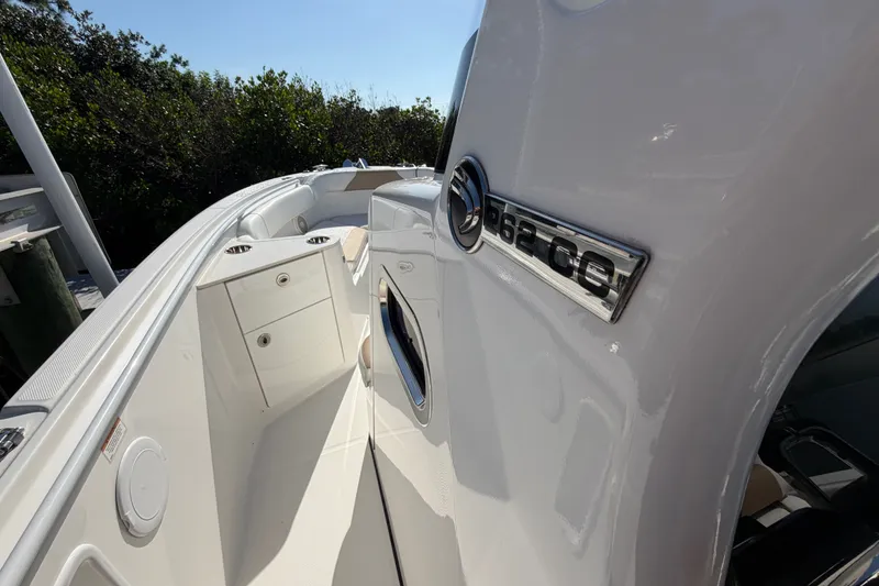 Slide: The Image of 2020 Edgewater 262CC boat interior with sleek design and storage compartments. - 22