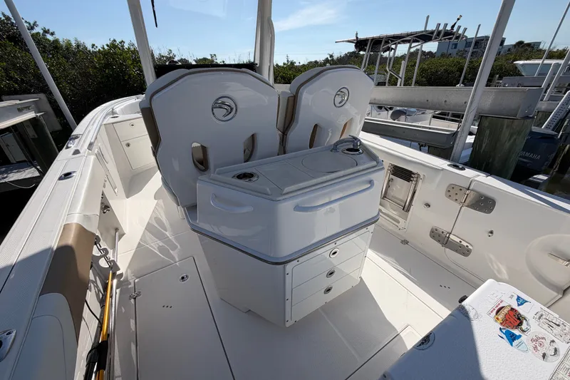 Slide: The Image of 2020 Edgewater 262CC boat interior with seating and storage compartments. - 12