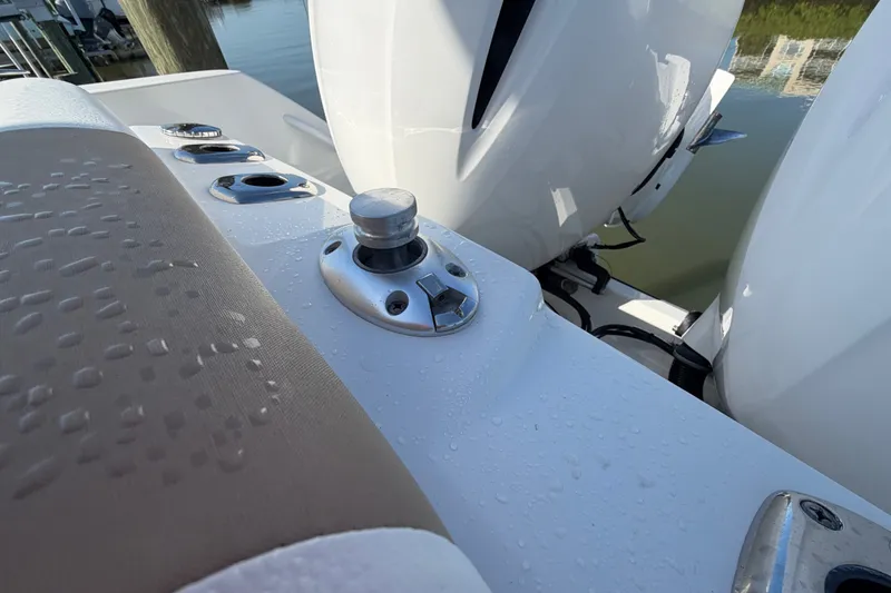 Slide: The Image of Edgewater 262CC 2020 boat with wet deck and dual outboard motors. - 17