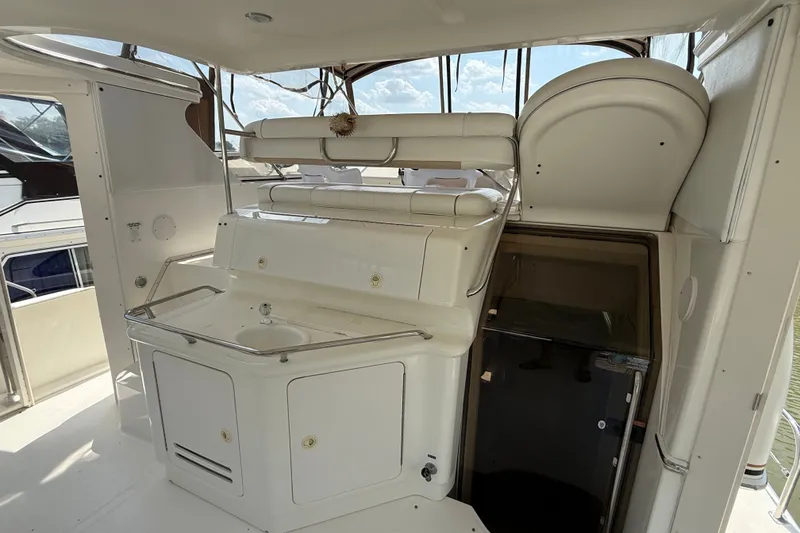 Slide: The Image of 1997 Sea Ray 370 Aft Cabin yacht interior with sink and storage area. - 16
