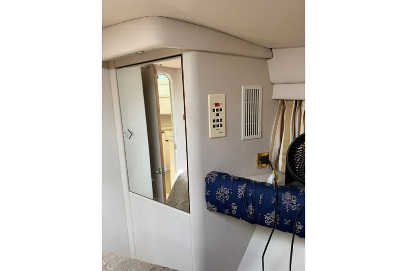 Slide: The Image of Interior of 1997 Sea Ray 370 Aft Cabin with mirror, control panel, and nautical decor. - 37