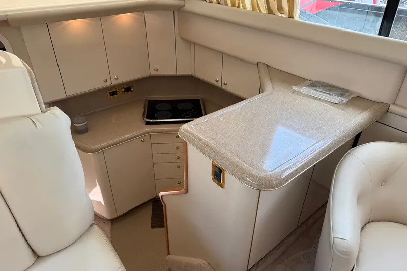 Slide: The Image of Luxurious 1997 Sea Ray 370 Aft Cabin yacht interior with modern kitchen amenities. - 29