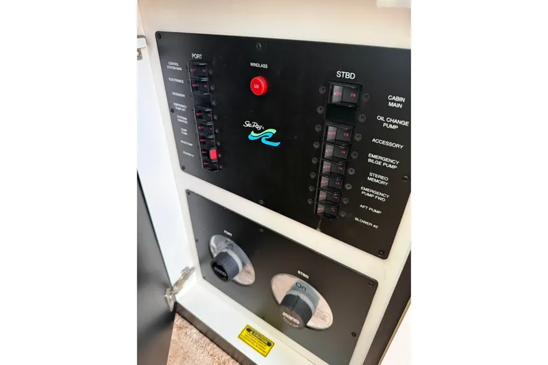 Slide: The Image of Control panel of a 1997 Sea Ray 370 Aft Cabin boat with switches and dials. - 50