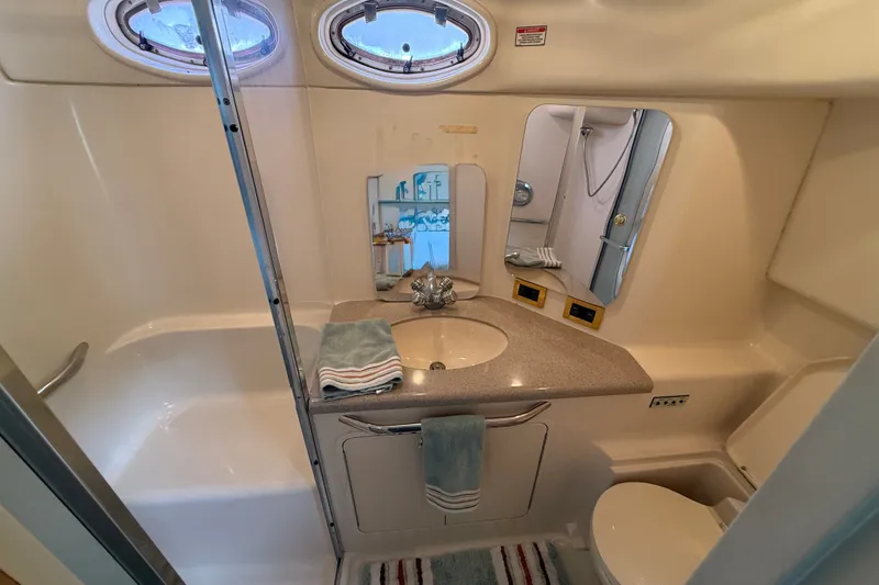 Slide: The Image of Bathroom interior of 1997 Sea Ray 370 Aft Cabin yacht, featuring sink and shower. - 46
