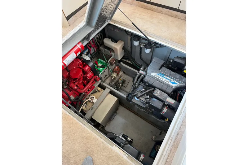 Slide: The Image of Engine compartment of a 1997 Sea Ray 370 Aft Cabin boat, showcasing mechanical components. - 51
