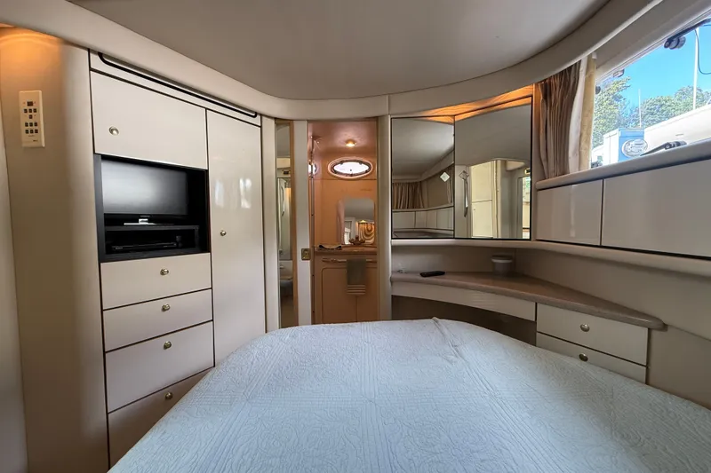 Slide: The Image of Luxurious interior of 1997 Sea Ray 370 Aft Cabin yacht with elegant furnishings. - 44