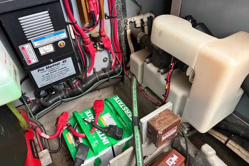 Slide: The Image of Electrical system and battery setup in a 1997 Sea Ray 370 Aft Cabin boat. - 54