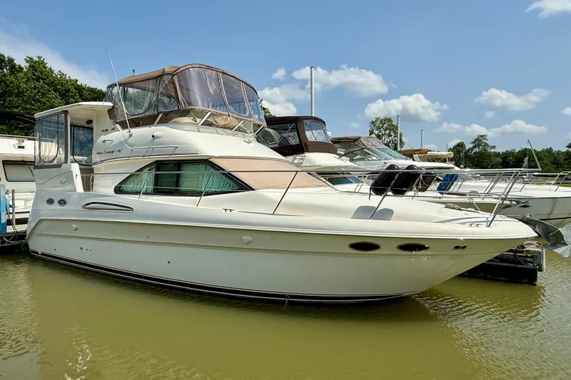 The Image of 1997 Sea Ray 370 Aft Cabin yacht docked on a sunny day. - 1