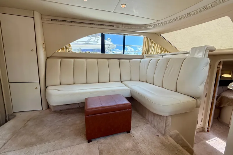 Slide: The Image of Luxurious interior of a 1997 Sea Ray 370 Aft Cabin yacht with plush seating. - 28