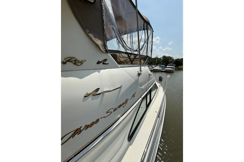 Slide: The Image of 1997 Sea Ray 370 Aft Cabin yacht docked on a sunny day. - 10