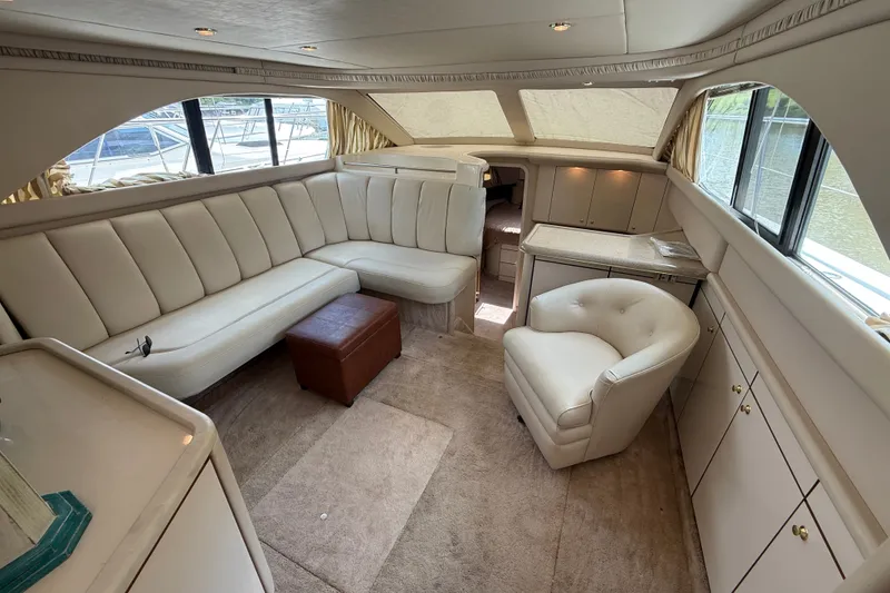 Slide: The Image of Luxurious interior of a 1997 Sea Ray 370 Aft Cabin yacht with plush seating. - 26