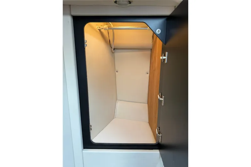 Slide: The Image of Interior storage compartment of a 1997 Sea Ray 370 Aft Cabin boat. - 38