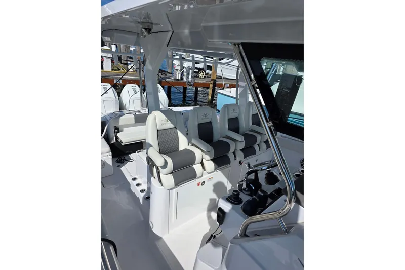 Slide: The Image of 2025 Bertram 39 CC boat interior with modern seating and controls. - 5