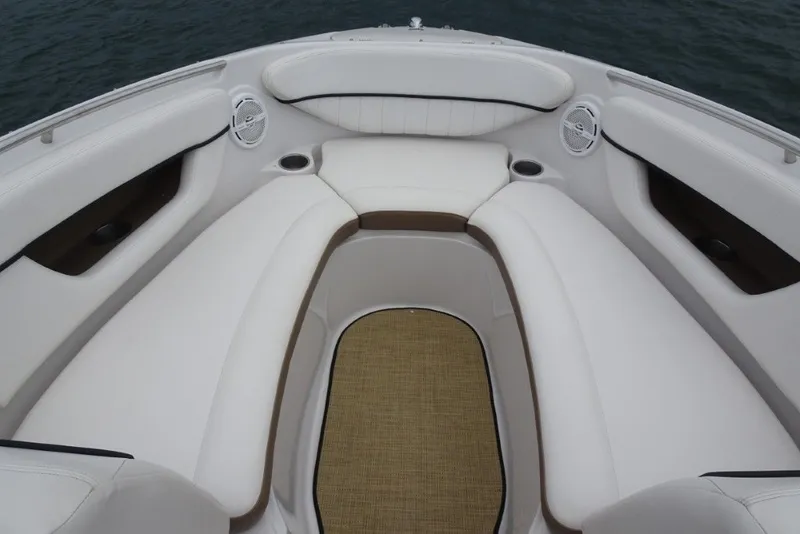 Slide: The Image of Luxurious seating area on a 2008 Four Winns H260 boat, featuring white upholstery. - 23