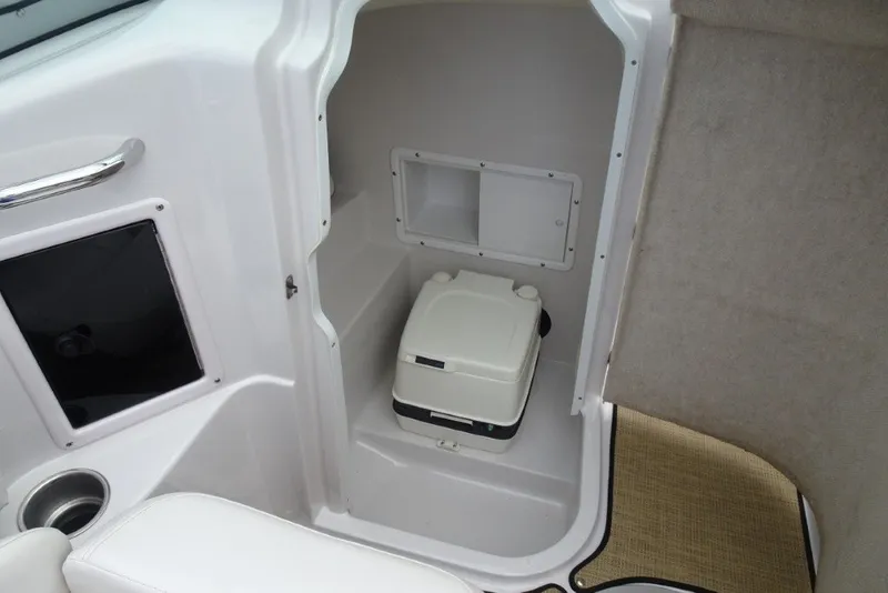 Slide: The Image of Interior of 2008 Four Winns H260 boat with compact marine toilet. - 22