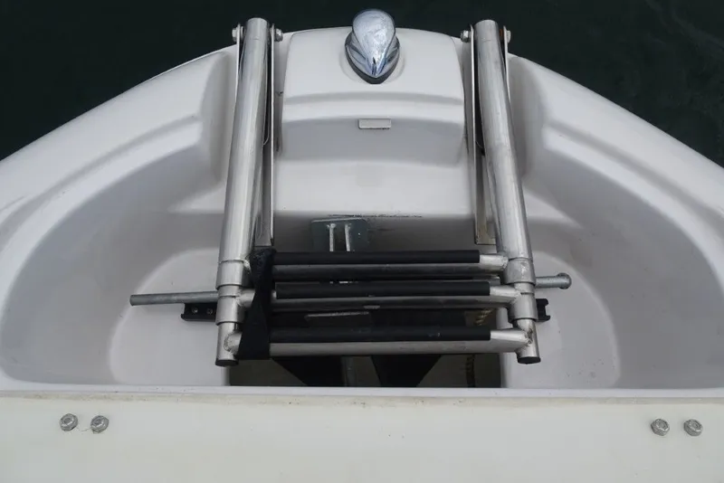 Slide: The Image of 2008 Four Winns H260 boat ladder and bow detail. - 25