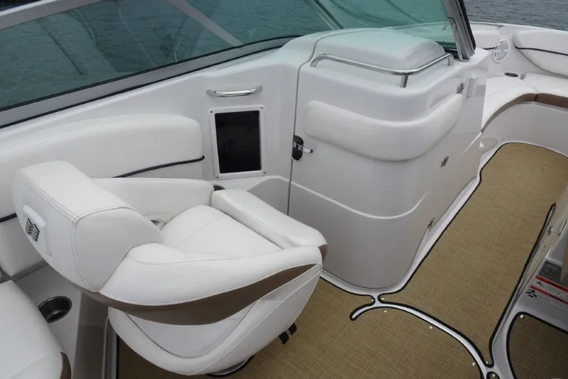 Slide: The Image of Luxurious interior of 2008 Four Winns H260 boat with white seating and beige flooring. - 19
