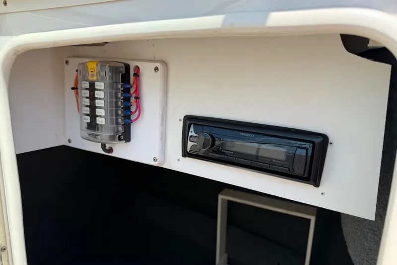 Slide: The Image of Electrical panel and Kenwood stereo in 2003 Sea Ray 240 Sundeck boat. - 5