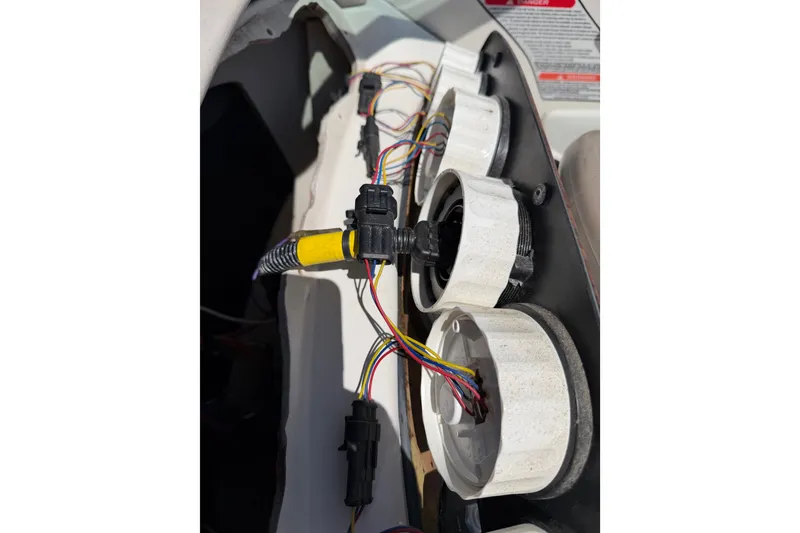 Slide: The Image of Wiring and gauges of a 2003 Sea Ray 240 Sundeck boat dashboard. - 12