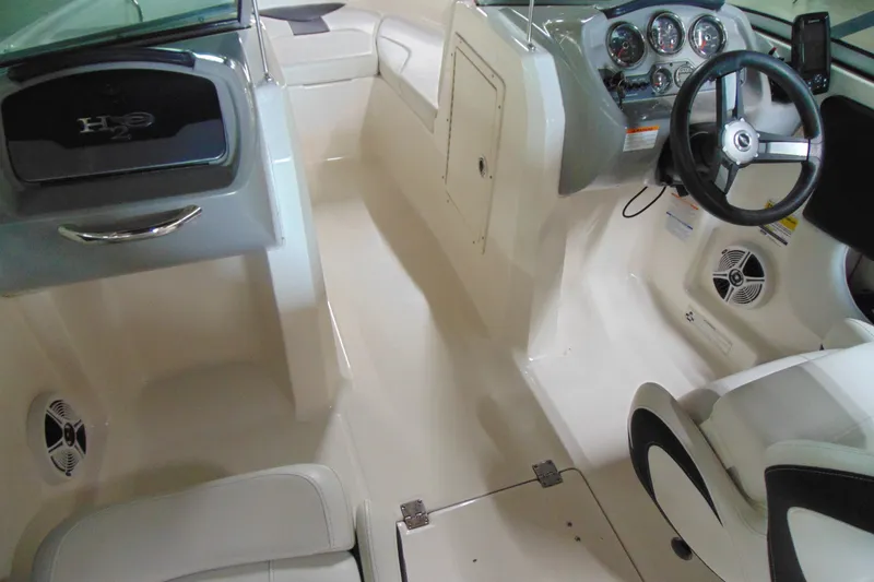 Slide: The Image of 2016 Chaparral 19 H2O Sport boat interior with steering wheel and dashboard. - 8