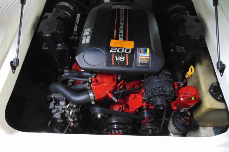 Slide: The Image of Engine compartment of 2016 Chaparral 19 H2O Sport boat, featuring a 200 V6 motor. - 14