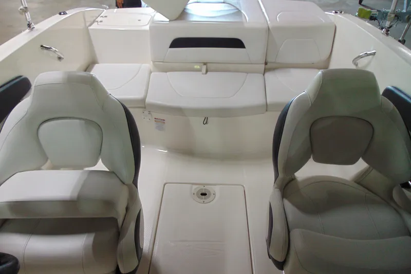 Slide: The Image of Interior of a 2016 Chaparral 19 H2O Sport boat with white seating. - 13