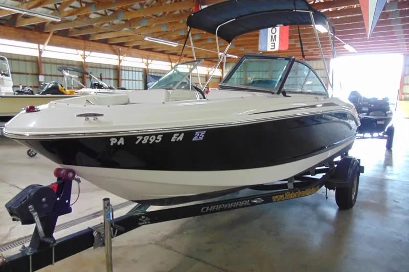 Slide: The Image of 2016 Chaparral 19 H2O Sport boat on trailer in indoor storage facility. - 3