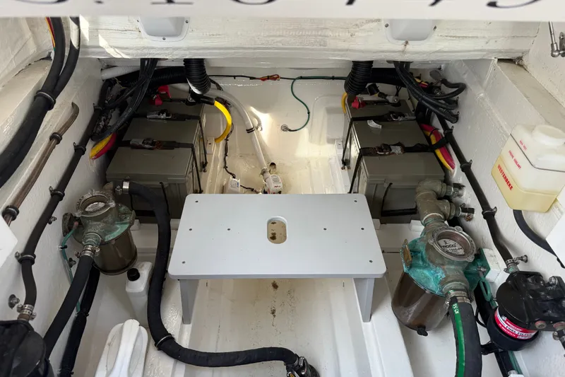 Slide: The Image of Engine compartment of 2024 MJM Yachts MJM 3, showcasing batteries and mechanical components. - 44