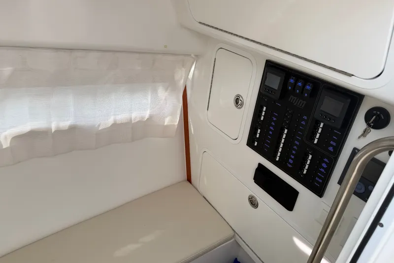 Slide: The Image of 2024 MJM Yachts MJM 3 interior with control panel and seating area. - 34