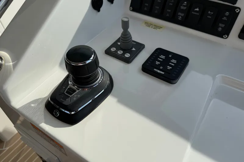 Slide: The Image of Control panel of 2024 MJM Yachts MJM 3, featuring joystick and electronic controls. - 25