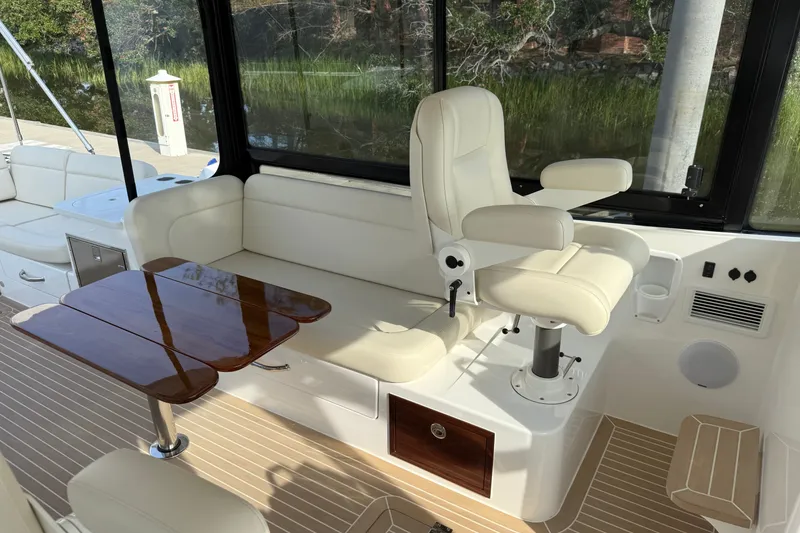 Slide: The Image of Luxurious interior of 2024 MJM Yachts MJM 3 with plush seating and elegant wood table. - 31