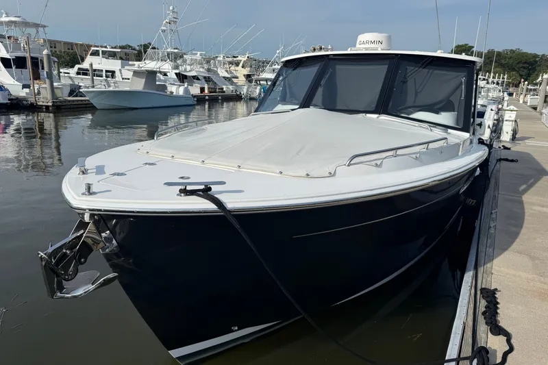 Slide: The Image of 2024 MJM Yachts MJM 3 docked at a marina, showcasing sleek design and modern features. - 48