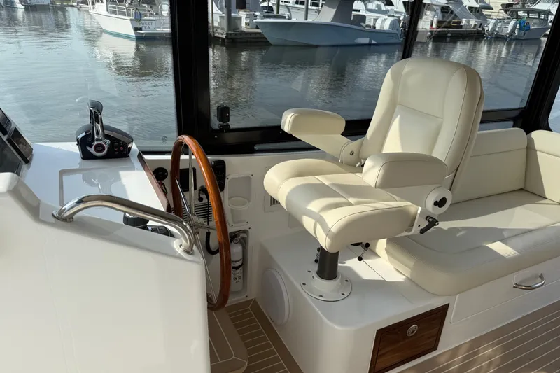 Slide: The Image of 2024 MJM Yachts MJM 3 helm with leather seat and wooden steering wheel. - 23