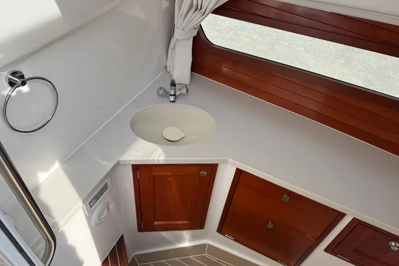 Slide: The Image of 2024 MJM Yachts MJM 3 bathroom with wooden cabinetry and modern sink design. - 38