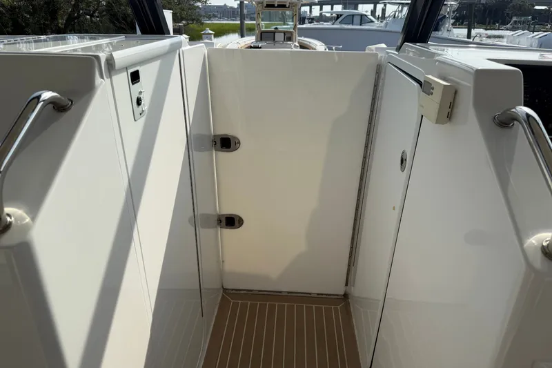 Slide: The Image of 2024 MJM Yachts MJM 3 interior with sleek white design and stainless steel accents. - 36