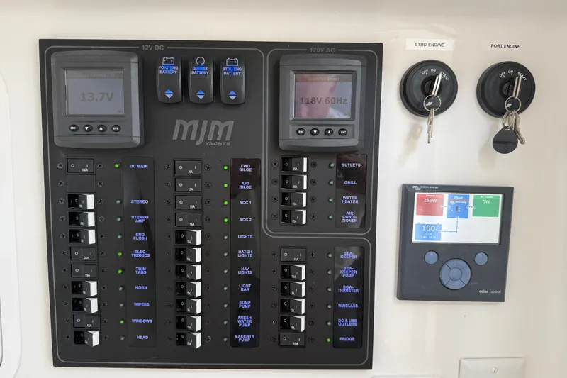 Slide: The Image of Electrical control panel of 2024 MJM Yachts MJM 3 with gauges and switches. - 29