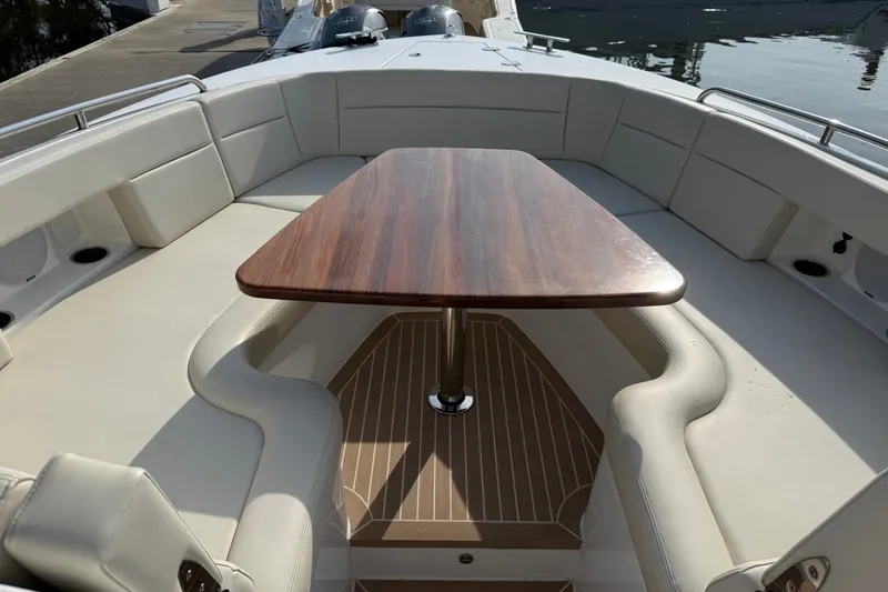 Slide: The Image of 2024 MJM Yachts MJM 3 boat interior with elegant seating and wooden table. - 39