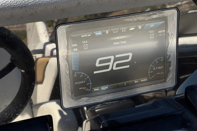 Slide: The Image of Dashboard display of 2022 Yamaha Boats 212S showing water temperature at 92°F. - 25
