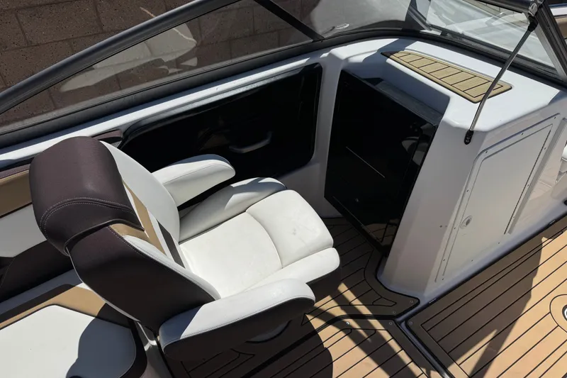 Slide: The Image of 2022 Yamaha Boats 212S interior with sleek seating and modern dashboard design. - 20