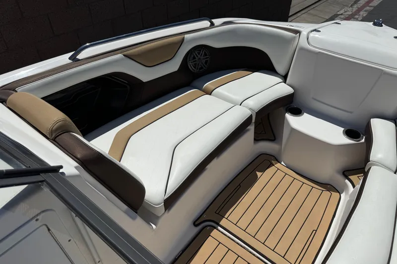 Slide: The Image of Interior of 2022 Yamaha Boats 212S, featuring stylish seating and cup holders. - 15