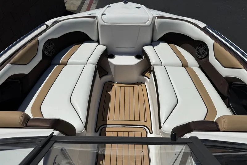 Slide: The Image of Interior view of 2022 Yamaha Boats 212S, featuring luxurious seating and sleek design. - 14