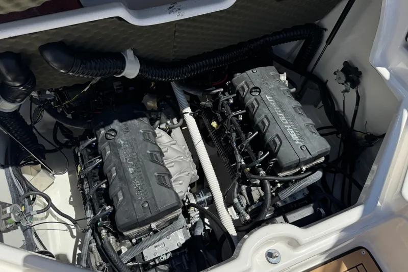 Slide: The Image of Engine compartment of a 2022 Yamaha Boats 212S, showcasing dual high-output engines. - 19