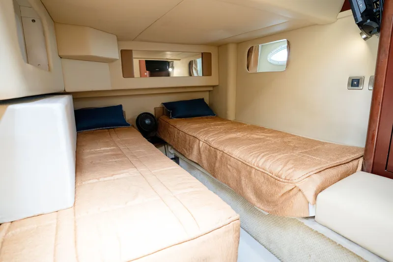 Slide: The Image of 2006 Sea Ray 44 Sedan Bridge cabin with twin beds and beige interior. - 35
