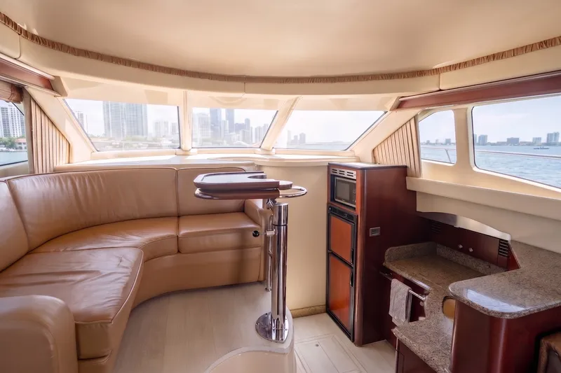 Slide: The Image of Luxurious interior of a 2006 Sea Ray 44 Sedan Bridge yacht with city skyline view. - 29