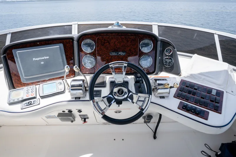 Slide: The Image of Helm of 2006 Sea Ray 44 Sedan Bridge with navigation equipment and controls. - 18